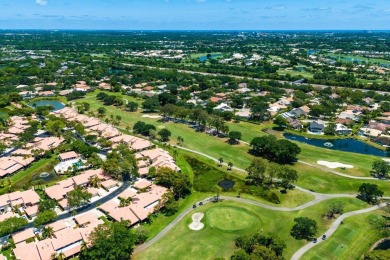 Discover resort-style living at its finest in this rarely on PGA National Golf Club in Florida - for sale on GolfHomes.com, golf home, golf lot