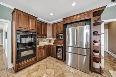 Welcome to 216 Dawn Island Trail, an elegant executive home with on Timberlake Country Club in South Carolina - for sale on GolfHomes.com, golf home, golf lot