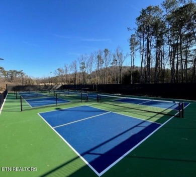 This lot is located in an Elite Waterfront Golf Community on Tennessee National Golf Club in Tennessee - for sale on GolfHomes.com, golf home, golf lot