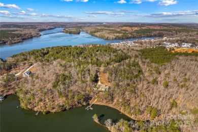 Located in the prestigious gated community of Heron Bay, this on Old North State Club at Uwharrie Point Golf community in North Carolina - for sale on GolfHomes.com, golf home, golf lot