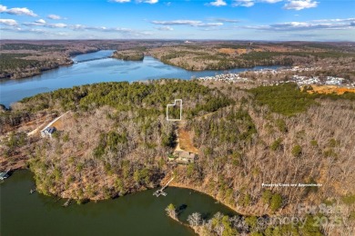 Located in the prestigious gated community of Heron Bay, this on Old North State Club at Uwharrie Point Golf community in North Carolina - for sale on GolfHomes.com, golf home, golf lot