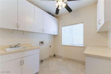 Located in the prestigious guard-gated Grand Legacy golf course on The Legacy Golf Club in Nevada - for sale on GolfHomes.com, golf home, golf lot