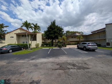 This beautifully renovated 3-bedroom, 2-bathroom corner unit at on Woodmont Country Club in Florida - for sale on GolfHomes.com, golf home, golf lot