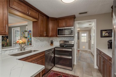 Live the Dunedin dream from this beautifully renovated on The Dunedin Country Club in Florida - for sale on GolfHomes.com, golf home, golf lot