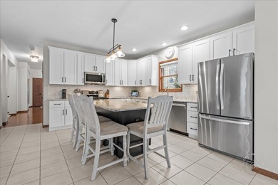 Located in coveted Mill Creek of Geneva, this beautifully on Mill Creek Golf Club in Illinois - for sale on GolfHomes.com, golf home, golf lot