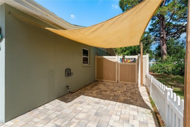 Live the Dunedin dream from this beautifully renovated on The Dunedin Country Club in Florida - for sale on GolfHomes.com, golf home, golf lot