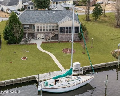 Experience resort-style living in this stunning waterfront home on Harbour Point Golf Club in North Carolina - for sale on GolfHomes.com, golf home, golf lot