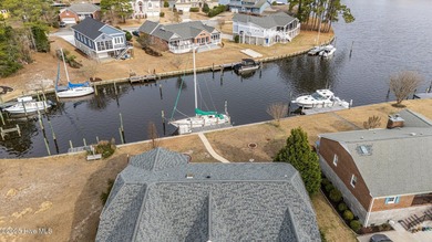 Experience resort-style living in this stunning waterfront home on Harbour Point Golf Club in North Carolina - for sale on GolfHomes.com, golf home, golf lot