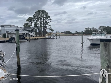 Experience resort-style living in this stunning waterfront home on Harbour Point Golf Club in North Carolina - for sale on GolfHomes.com, golf home, golf lot