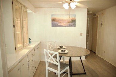 This lovely, 2/2 manufactured home on leased land in Lake on Pine Lakes Country Club in Florida - for sale on GolfHomes.com, golf home, golf lot