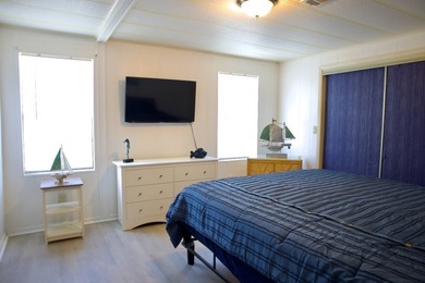 This lovely, 2/2 manufactured home on leased land in Lake on Pine Lakes Country Club in Florida - for sale on GolfHomes.com, golf home, golf lot