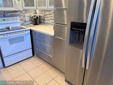 FANTASTIC REMODELED 2 BEDROOMS GROUND FLOOR, Stainless steel on Hillsboro Pines Golf in Florida - for sale on GolfHomes.com, golf home, golf lot