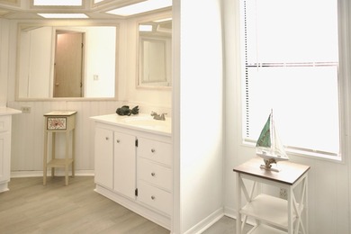 This lovely, 2/2 manufactured home on leased land in Lake on Pine Lakes Country Club in Florida - for sale on GolfHomes.com, golf home, golf lot