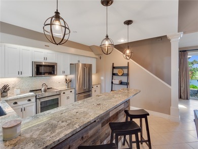 Stunning and turnkey villa right on the golf course in sought on Grand Harbor Golf and Country Club in Florida - for sale on GolfHomes.com, golf home, golf lot