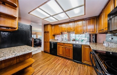 Under contract-accepting backup offers. NEW PRICE!! This warm on East Lake Woodlands Country Club in Florida - for sale on GolfHomes.com, golf home, golf lot
