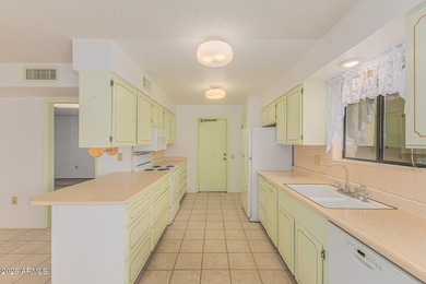 Welcome to this bright and charming end-unit garden condo in Sun on Pebblebrook Golf Course in Arizona - for sale on GolfHomes.com, golf home, golf lot