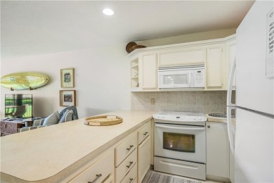 Enjoy relaxed resort-style living in this condo overlooking the on Ocean Village Golf Course in Florida - for sale on GolfHomes.com, golf home, golf lot