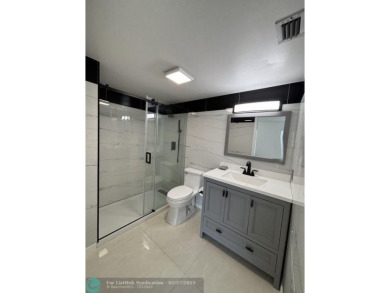 A stunning modern redesigned condo showcases impeccable on Wynmoor Golf Course in Florida - for sale on GolfHomes.com, golf home, golf lot