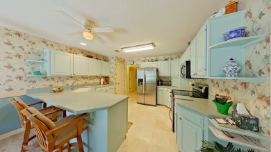 Nestled on the 3rd tee box, this beautifully designed 3-bedroom on Shalimar Pointe Golf and Country Club in Florida - for sale on GolfHomes.com, golf home, golf lot