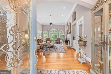 This exquisite four-sided blush brick estate is the epitome of on Royal Lakes Golf and Country Club in Georgia - for sale on GolfHomes.com, golf home, golf lot