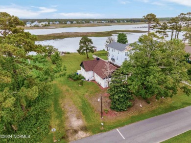 Experience waterfront living at its finest at 5802 E Yacht Drive on Founders Club At St. James Plantation in North Carolina - for sale on GolfHomes.com, golf home, golf lot