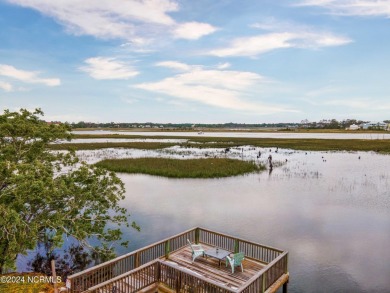 Experience waterfront living at its finest at 5802 E Yacht Drive on Founders Club At St. James Plantation in North Carolina - for sale on GolfHomes.com, golf home, golf lot