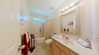 Nestled on the 3rd tee box, this beautifully designed 3-bedroom on Shalimar Pointe Golf and Country Club in Florida - for sale on GolfHomes.com, golf home, golf lot