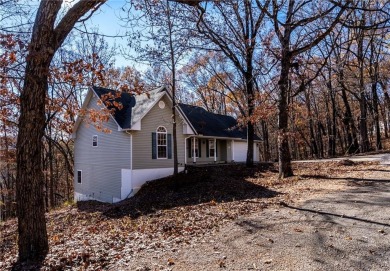 Beautiful home located on a quiet cul-de-sac surrounded by woods on Holiday Island Executive Golf Course in Arkansas - for sale on GolfHomes.com, golf home, golf lot