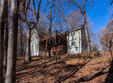 Beautiful home located on a quiet cul-de-sac surrounded by woods on Holiday Island Executive Golf Course in Arkansas - for sale on GolfHomes.com, golf home, golf lot