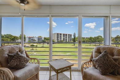 WELCOME TO THIS SPACIOUS, ATTRACTIVE CORNER, TOP FLOOR  CONDO on Poinciana Golf Club in Florida - for sale on GolfHomes.com, golf home, golf lot