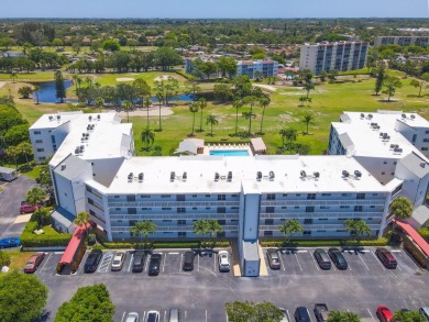 WELCOME TO THIS SPACIOUS, ATTRACTIVE CORNER, TOP FLOOR  CONDO on Poinciana Golf Club in Florida - for sale on GolfHomes.com, golf home, golf lot