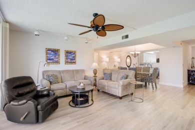 WELCOME TO THIS SPACIOUS, ATTRACTIVE CORNER, TOP FLOOR  CONDO on Poinciana Golf Club in Florida - for sale on GolfHomes.com, golf home, golf lot