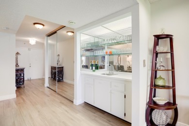 WELCOME TO THIS SPACIOUS, ATTRACTIVE CORNER, TOP FLOOR  CONDO on Poinciana Golf Club in Florida - for sale on GolfHomes.com, golf home, golf lot