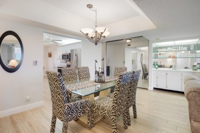WELCOME TO THIS SPACIOUS, ATTRACTIVE CORNER, TOP FLOOR  CONDO on Poinciana Golf Club in Florida - for sale on GolfHomes.com, golf home, golf lot
