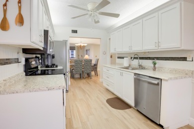WELCOME TO THIS SPACIOUS, ATTRACTIVE CORNER, TOP FLOOR  CONDO on Poinciana Golf Club in Florida - for sale on GolfHomes.com, golf home, golf lot