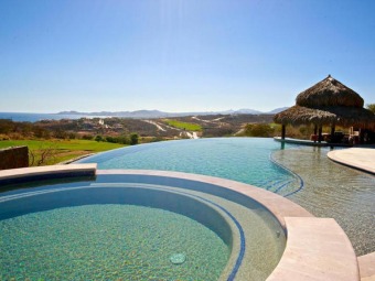 Set on the ninth fairway of the Greg Norman Signature course, in on Puerto Los Cabos Golf Resort in Baja California Sur, Mexico - for sale on GolfHomes.com, golf home, golf lot