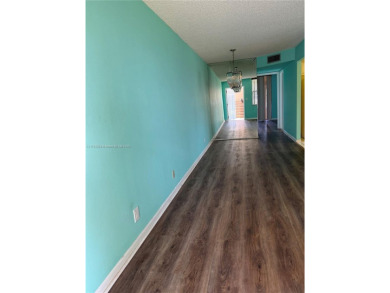 Fabulous 1st floor unit, corner unit, bright and beautiful.  55 on Sunrise Lakes Phase III in Florida - for sale on GolfHomes.com, golf home, golf lot