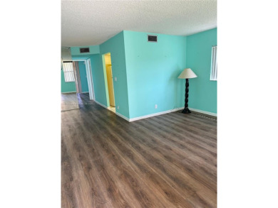Fabulous 1st floor unit, corner unit, bright and beautiful.  55 on Sunrise Lakes Phase III in Florida - for sale on GolfHomes.com, golf home, golf lot