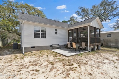 Imagine stepping into a charming getaway on Oak Island, NC on Founders Club At St. James Plantation in North Carolina - for sale on GolfHomes.com, golf home, golf lot