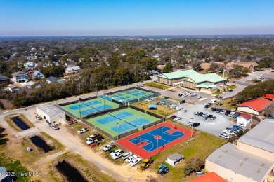 Imagine stepping into a charming getaway on Oak Island, NC on Founders Club At St. James Plantation in North Carolina - for sale on GolfHomes.com, golf home, golf lot