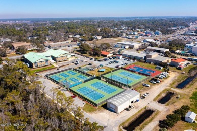 Imagine stepping into a charming getaway on Oak Island, NC on Founders Club At St. James Plantation in North Carolina - for sale on GolfHomes.com, golf home, golf lot