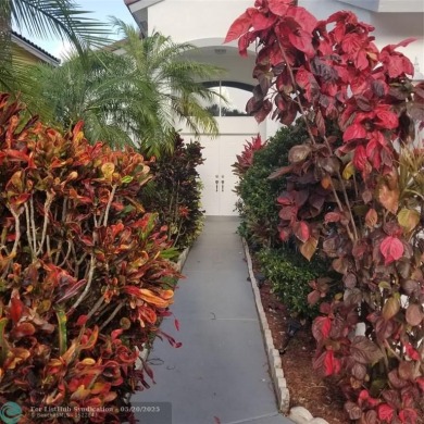 Nestled in the highly sought-after, gated golf course community on Atlantic National Golf and Country Club in Florida - for sale on GolfHomes.com, golf home, golf lot