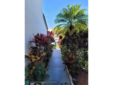 Nestled in the highly sought-after, gated golf course community on Atlantic National Golf and Country Club in Florida - for sale on GolfHomes.com, golf home, golf lot