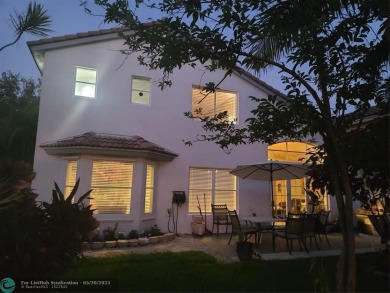Nestled in the highly sought-after, gated golf course community on Atlantic National Golf and Country Club in Florida - for sale on GolfHomes.com, golf home, golf lot