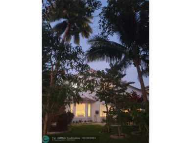 Nestled in the highly sought-after, gated golf course community on Atlantic National Golf and Country Club in Florida - for sale on GolfHomes.com, golf home, golf lot