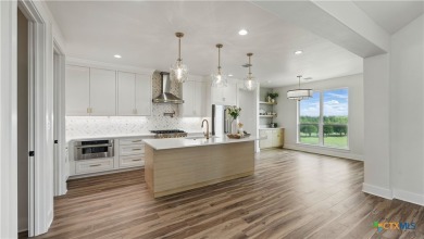 This stunning new build with exceptional views is located on the on The Bandit Golf Club in Texas - for sale on GolfHomes.com, golf home, golf lot