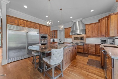 This 4 bedroom, 4 and a half-bath home offers over 170 feet of on TPC at Wakefield Plantation in North Carolina - for sale on GolfHomes.com, golf home, golf lot