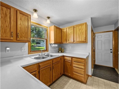 Welcome to this beautifully maintained 3-bedroom, 2-bath home on Buffalo Heights Golf Course in Minnesota - for sale on GolfHomes.com, golf home, golf lot