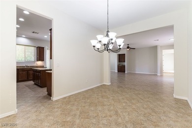 Step into refined living in this impeccably maintained Trenton on Revere Golf Club in Nevada - for sale on GolfHomes.com, golf home, golf lot