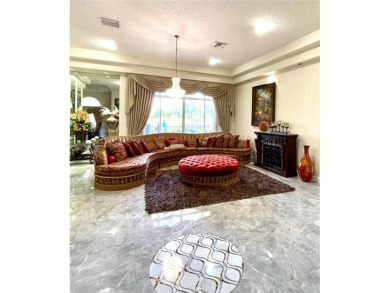 Located behind the prestigious guard-gated entrances of Eagle on TPC Eagle Trace in Florida - for sale on GolfHomes.com, golf home, golf lot